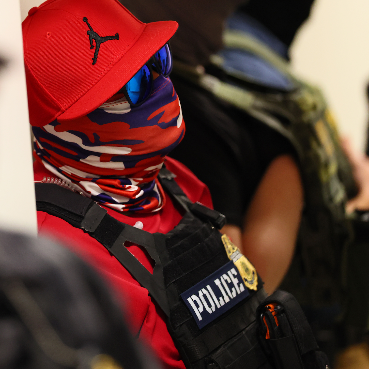 ICE agents are hiding their faces during raids. Is that legal?